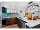 Updated kitchen featuring dark wood cabinets and a farmhouse sink at 3700 S Osprey Ave # 214, Sarasota, FL 34239