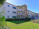 Condo building showcasing landscaping and parking area at 4480 Ironwood Cir # 202A, Bradenton, FL 34209