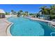 Inviting kidney-shaped pool with surrounding lounge chairs at 4480 Ironwood Cir # 202A, Bradenton, FL 34209