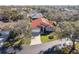 Aerial view of single-Gathering home with red tile roof and landscaped yard at 5296 White Sand Ne Cir, St Petersburg, FL 33703