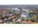 Wide aerial view of a residential neighborhood near a lake at 5296 White Sand Ne Cir, St Petersburg, FL 33703