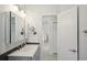 Bright bathroom with double vanity and view of living room at 5296 White Sand Ne Cir, St Petersburg, FL 33703