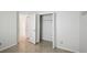 Simple bedroom with large closet and gray flooring at 5296 White Sand Ne Cir, St Petersburg, FL 33703