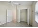 Bright bedroom with ceiling fan and closet at 5296 White Sand Ne Cir, St Petersburg, FL 33703