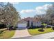 House exterior with driveway and manicured lawn at 5296 White Sand Ne Cir, St Petersburg, FL 33703