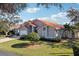 Single story home with tile roof and landscaped yard at 5296 White Sand Ne Cir, St Petersburg, FL 33703