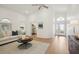 Living room with hardwood floors, and view of the entryway at 5296 White Sand Ne Cir, St Petersburg, FL 33703