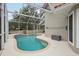 Refreshing kidney-shaped pool, screened for privacy at 5296 White Sand Ne Cir, St Petersburg, FL 33703