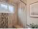 Spa-like shower with tiled walls and built-in seat at 5296 White Sand Ne Cir, St Petersburg, FL 33703