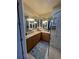 Elegant bathroom with double vanity and corner sink at 7937 St Simons St # 7937, University Park, FL 34201