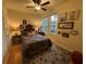 Cozy bedroom with hardwood floors and large windows at 7937 St Simons St # 7937, University Park, FL 34201