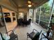 Relaxing screened porch with seating area and view of nature at 7937 St Simons St # 7937, University Park, FL 34201