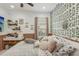 Bedroom with a plant wall and cozy bed at 12046 Forest Park Cir, Bradenton, FL 34211