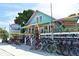 Beach rentals and bike shop with colorful building at 114 31St St, Holmes Beach, FL 34217