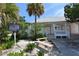 Quaint building exterior with a historical marker and bench at 114 31St St, Holmes Beach, FL 34217