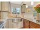 Kitchen features a farmhouse sink and light wood cabinets at 114 31St St, Holmes Beach, FL 34217