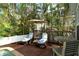 Relaxing pool deck with lounge chairs, umbrella, and small table at 114 31St St, Holmes Beach, FL 34217