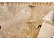 Walk-in shower with granite seat and tile surround at 114 31St St, Holmes Beach, FL 34217