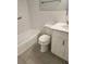 Updated bathroom with a white vanity, toilet, and bathtub at 33 S Gulfstream Ave # 307, Sarasota, FL 34236