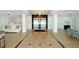 Elegant building lobby with tiled floors and chandelier at 33 S Gulfstream Ave # 307, Sarasota, FL 34236