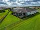 Aerial view of house, pool and fenced backyard at 4950 Kiva Cir, Bradenton, FL 34211