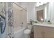 Clean bathroom with shower/tub combo, toilet and vanity with a modern design at 4950 Kiva Cir, Bradenton, FL 34211