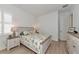 Guest bedroom with light wood flooring and white dresser at 4950 Kiva Cir, Bradenton, FL 34211