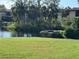 A lush backyard with a water view offers peaceful outdoor enjoyment at 6447 Egret Ln # 413, Bradenton, FL 34210