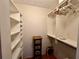 The walk-in closet offers custom shelving and storage space at 6447 Egret Ln # 413, Bradenton, FL 34210