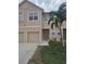 Two-story townhome with attached garage and landscaped lawn at 3846 Virga Blvd, Sarasota, FL 34233