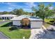 An aerial view showcasing a home's exterior and a lake at 449 Botticelli Dr # 449, Nokomis, FL 34275