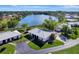 Aerial view of a home on a lake with lush landscaping at 449 Botticelli Dr # 449, Nokomis, FL 34275