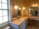 Bright bathroom with double vanity and large mirror at 449 Botticelli Dr # 449, Nokomis, FL 34275