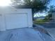 White garage door with a spacious driveway at 449 Botticelli Dr # 449, Nokomis, FL 34275