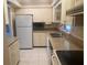 Clean kitchen featuring white cabinets and granite countertops at 449 Botticelli Dr # 449, Nokomis, FL 34275