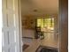 Living room with rocking chair and view of patio at 449 Botticelli Dr # 449, Nokomis, FL 34275