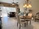 Bright dining area with a view to the living room and patio at 7225 Cedar Hollow Cir # 20-201, Bradenton, FL 34203
