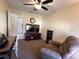 Home office features a desk, media cabinet, and comfy recliner at 7225 Cedar Hollow Cir # 20-201, Bradenton, FL 34203