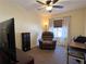 Functional home office with a recliner, desk, and media cabinet at 7225 Cedar Hollow Cir # 20-201, Bradenton, FL 34203