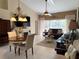 Spacious living room with a dining area and sliding glass doors at 7225 Cedar Hollow Cir # 20-201, Bradenton, FL 34203