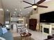 Bright living room features a fireplace and a view to the kitchen at 7225 Cedar Hollow Cir # 20-201, Bradenton, FL 34203