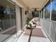 Relaxing screened balcony with wicker furniture and ceiling fan at 7225 Cedar Hollow Cir # 20-201, Bradenton, FL 34203