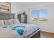 Main bedroom with ocean views and dresser at 1102 Benjamin Franklin Dr # 409, Sarasota, FL 34236