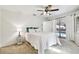 Bright bedroom with pool view, featuring a ceiling fan and sliding glass doors at 117 Hillcrest Dr, Bradenton, FL 34209