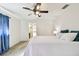 Main bedroom with ceiling fan and ensuite bathroom at 117 Hillcrest Dr, Bradenton, FL 34209