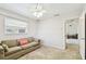 Bright bedroom with carpet flooring and a view of the backyard at 117 Hillcrest Dr, Bradenton, FL 34209