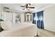 Bedroom with pool view, ceiling fan and window curtains at 117 Hillcrest Dr, Bradenton, FL 34209