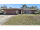 Single-story house with stone facade and attached garage at 117 Hillcrest Dr, Bradenton, FL 34209