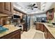 Modern kitchen with stainless steel appliances and granite countertops at 117 Hillcrest Dr, Bradenton, FL 34209