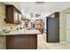 Kitchen with granite countertop, wooden cabinets and stainless steel appliances at 117 Hillcrest Dr, Bradenton, FL 34209